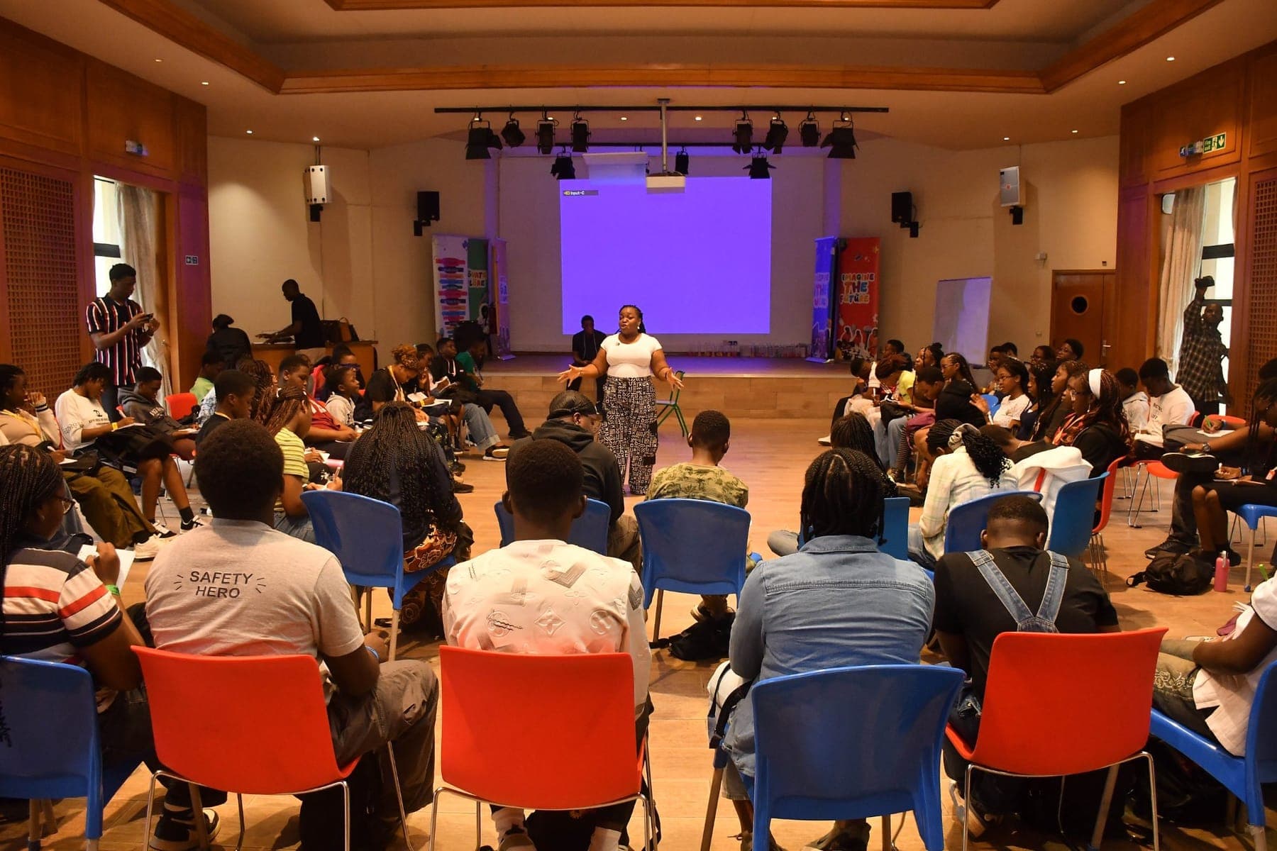 A full hall, ready to learn